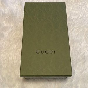 - Green GUCCI box with tissue paper
